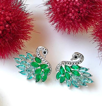 Emerald Grace Swan Stud Earrings - Like a gentle whisper of nature, these green swan studs grace your ears with elegance and serene beauty.