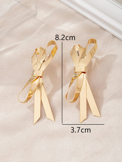 Golden Bow-Tique - 14K Gold Plated Elegance with a Playful Twist